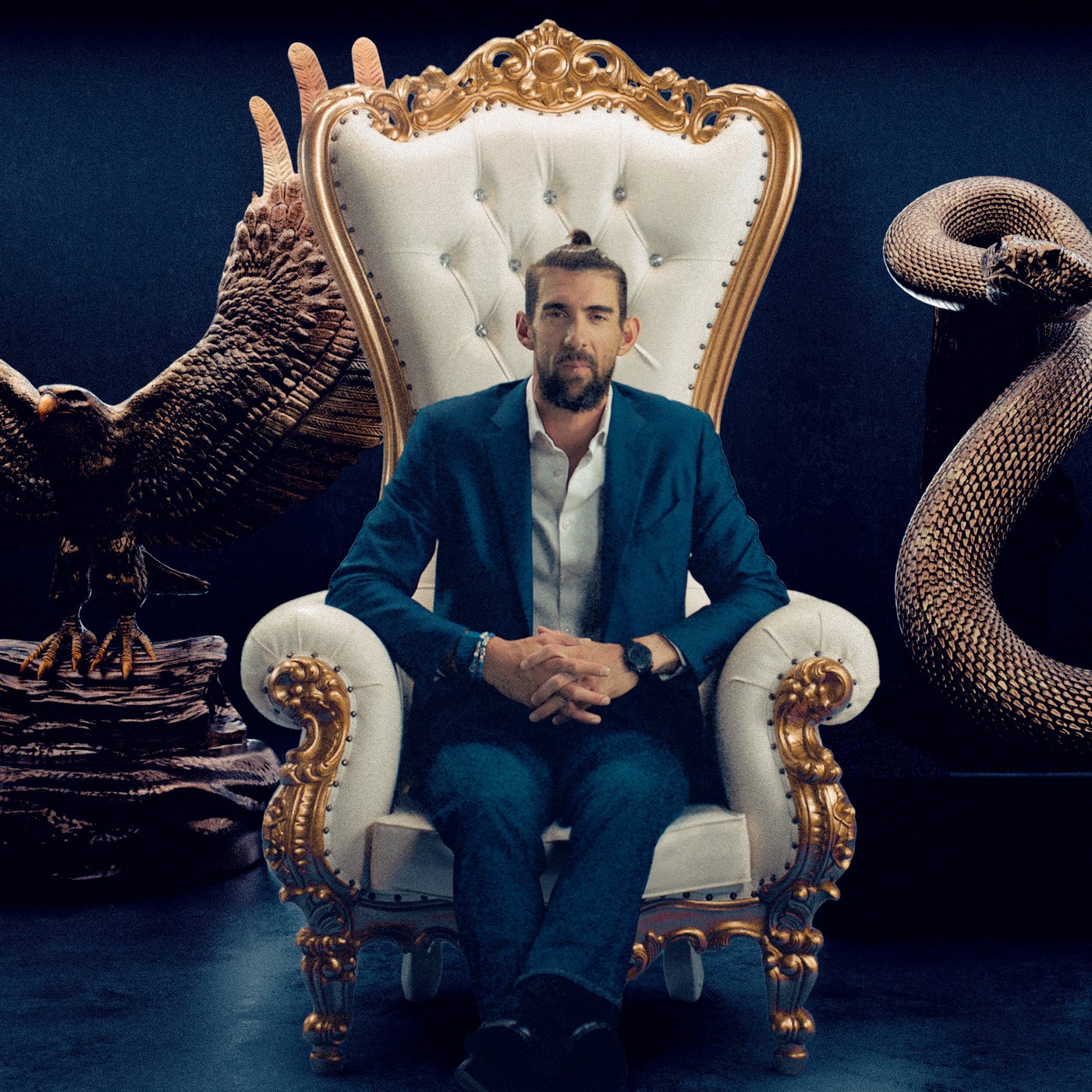 Michael Phelps seated on a throne between eagle and snake sculptures for Global Poker